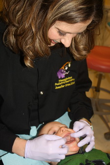 Pediatric dentist Dr. Jennifer Criss with a patient