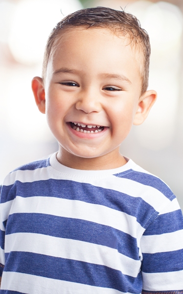 Smiling boy in blue striped shirt